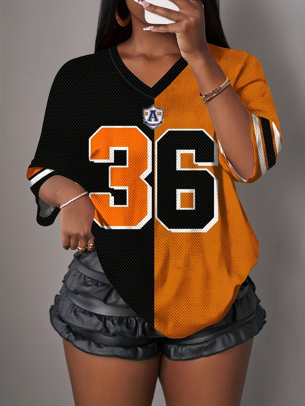 Women’s breathable mesh V-neck t-shirt with bold number 36 print.