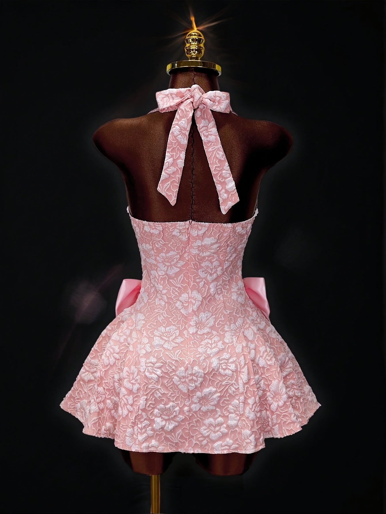 Pink halter dress with tulle skirt for summer outings.
