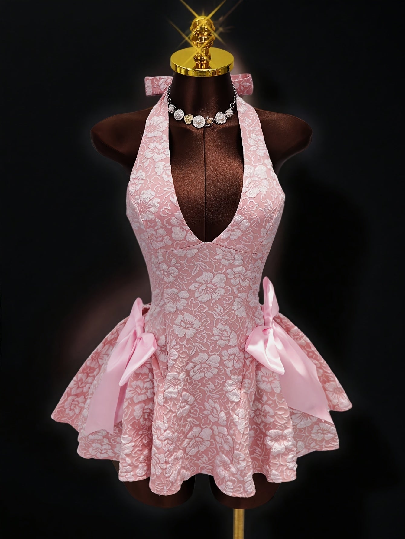 Pink halter dress with tulle skirt for summer outings.