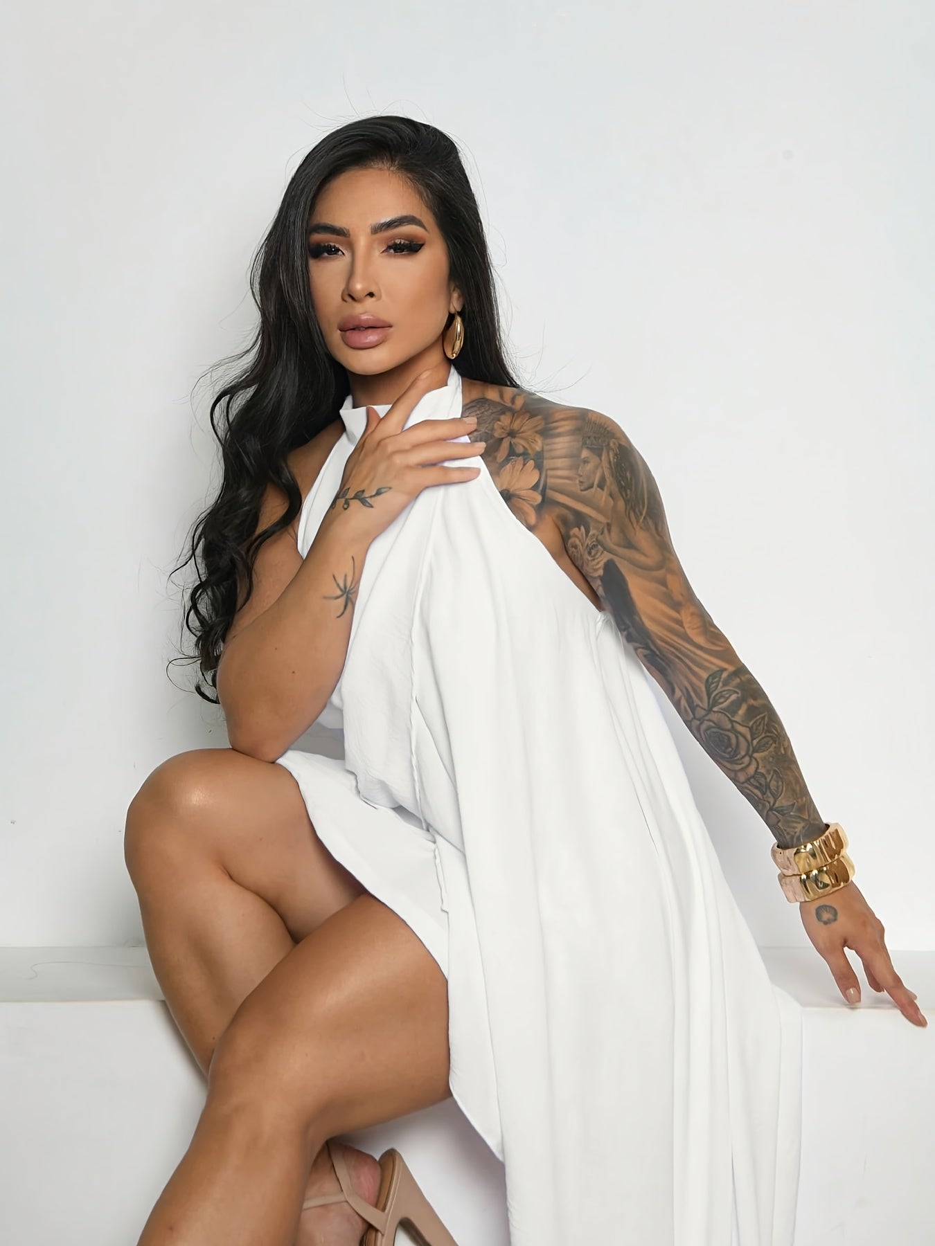 A Solid Color Summer Dress with a Loose Fit, Shorter in The Front And Longer in The Back, Featuring an Elegant Bohemian Style. The Backless Short Design Is Perfect for Parties, Graduation Ceremonies, And Weddings