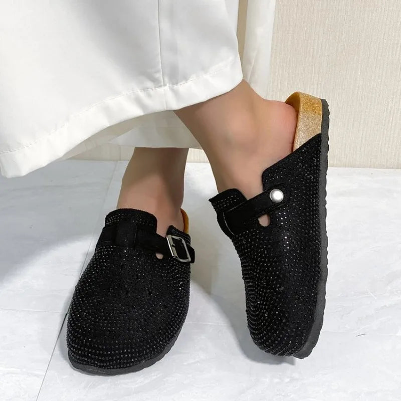Women’s shoes: shiny rhinestone slippers, platform sandals, and cork clogs.