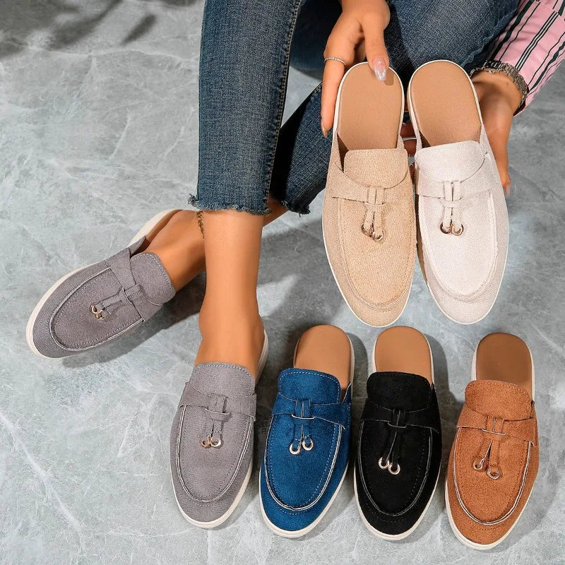 Women’s casual loafers with tassel, buckle, and slip-on design.