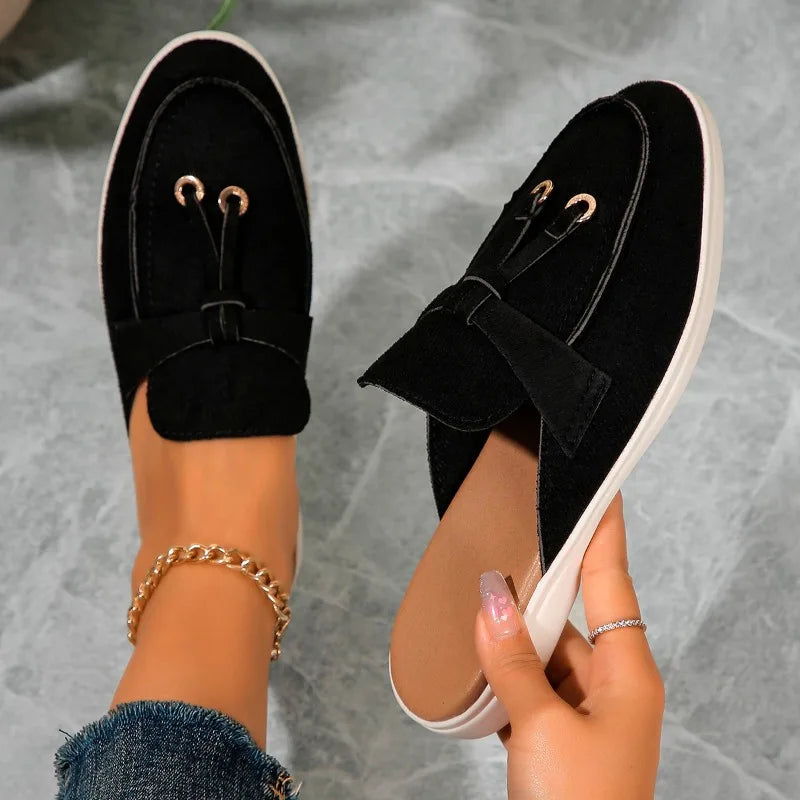 Women’s casual loafers with tassel, buckle, and slip-on design.