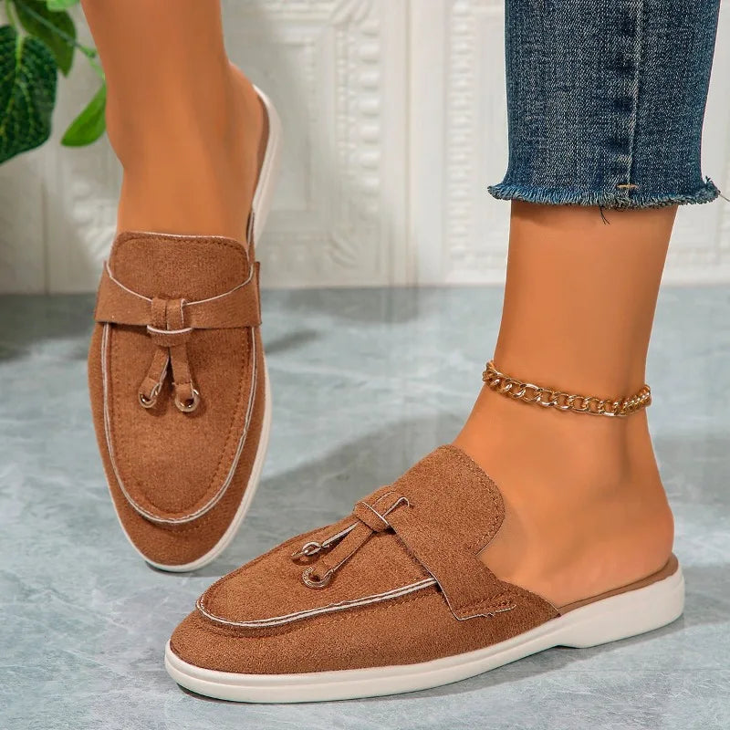 Women’s casual loafers with tassel, buckle, and slip-on design.